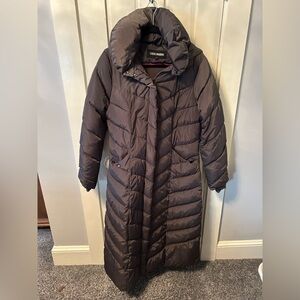 Very warm puffer coat. Goes well past the knees. Super thick and really cozy.